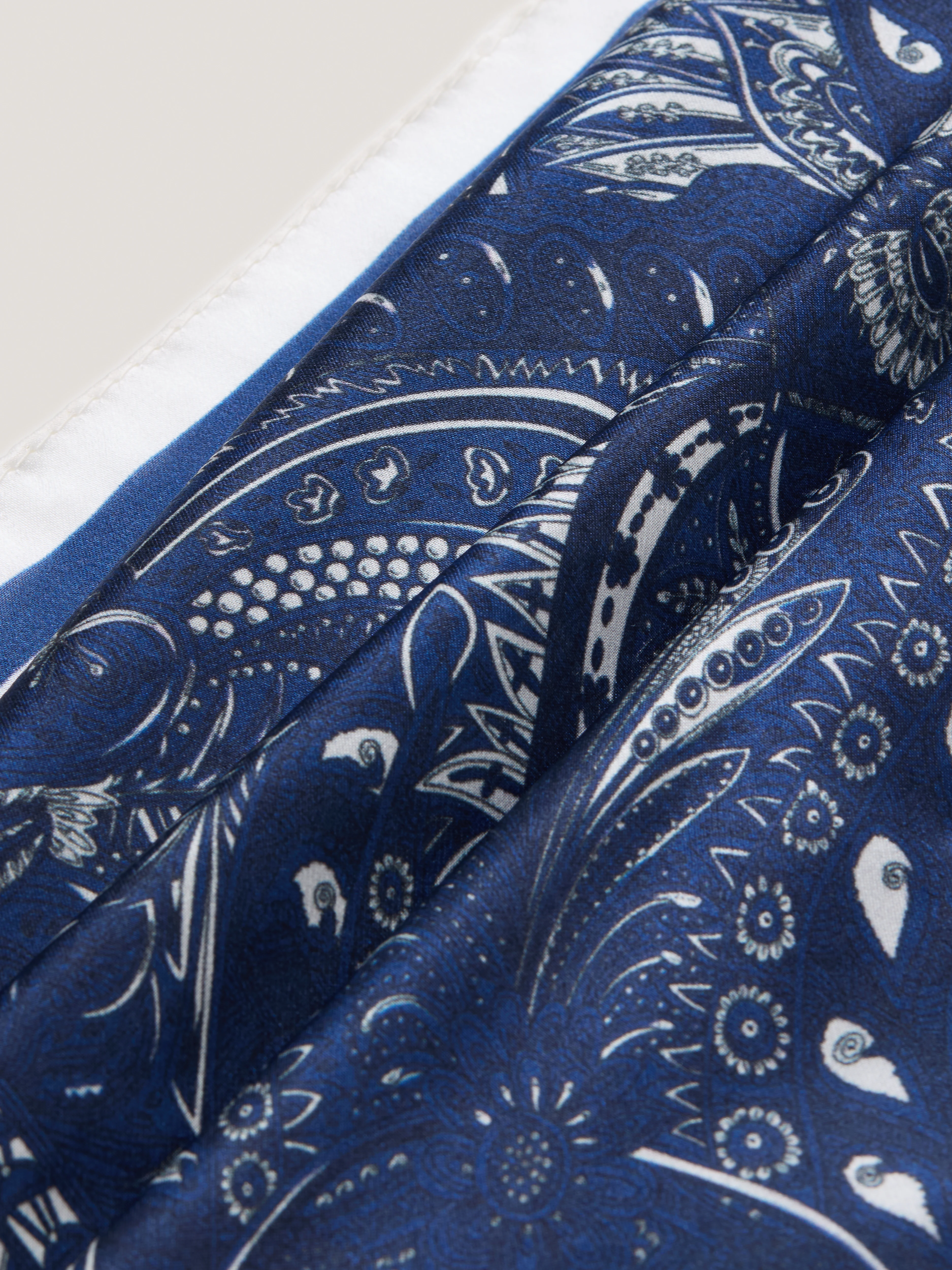 A silk scarf with a paisley pattern