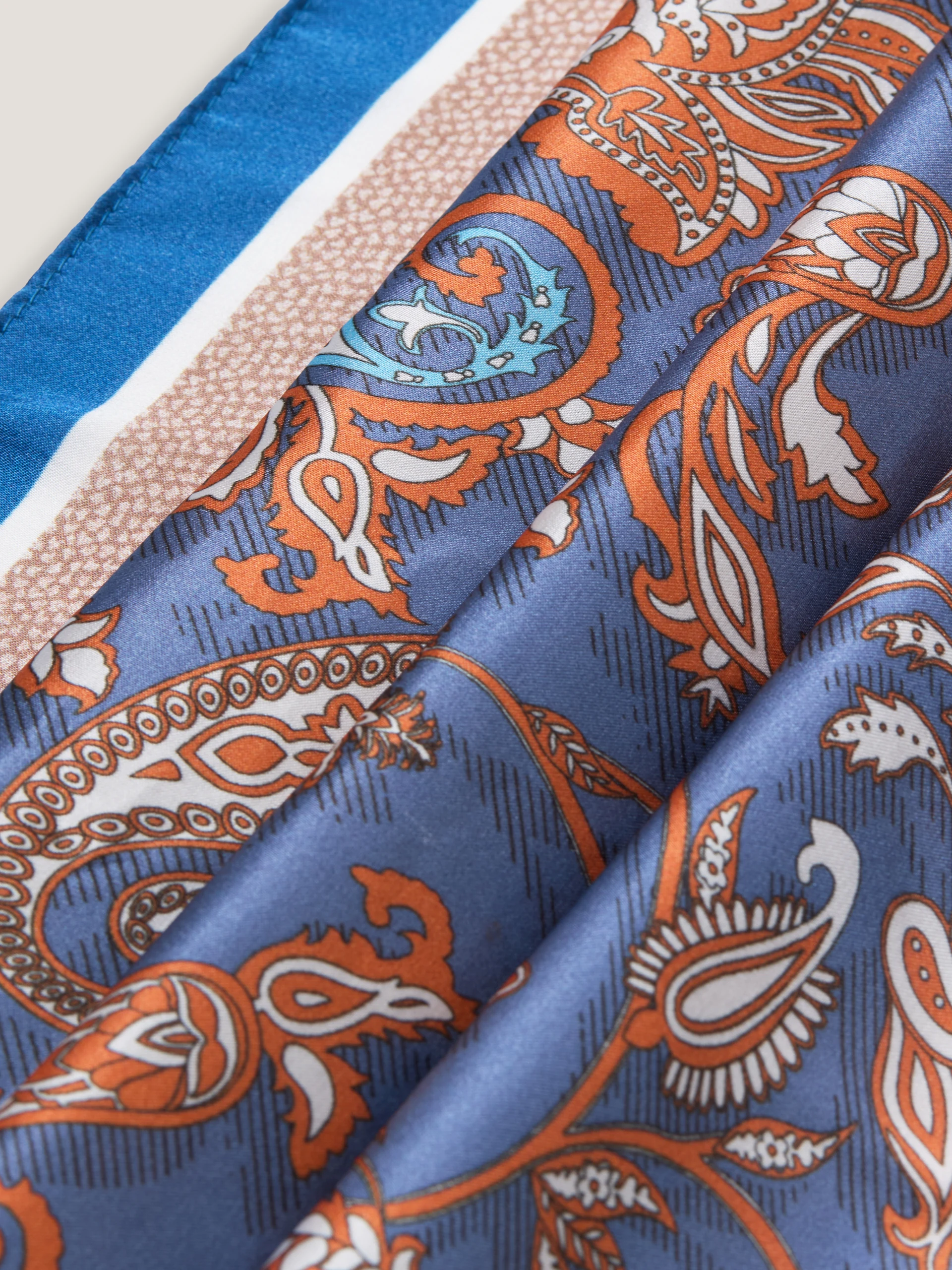 A silk scarf with a paisley pattern