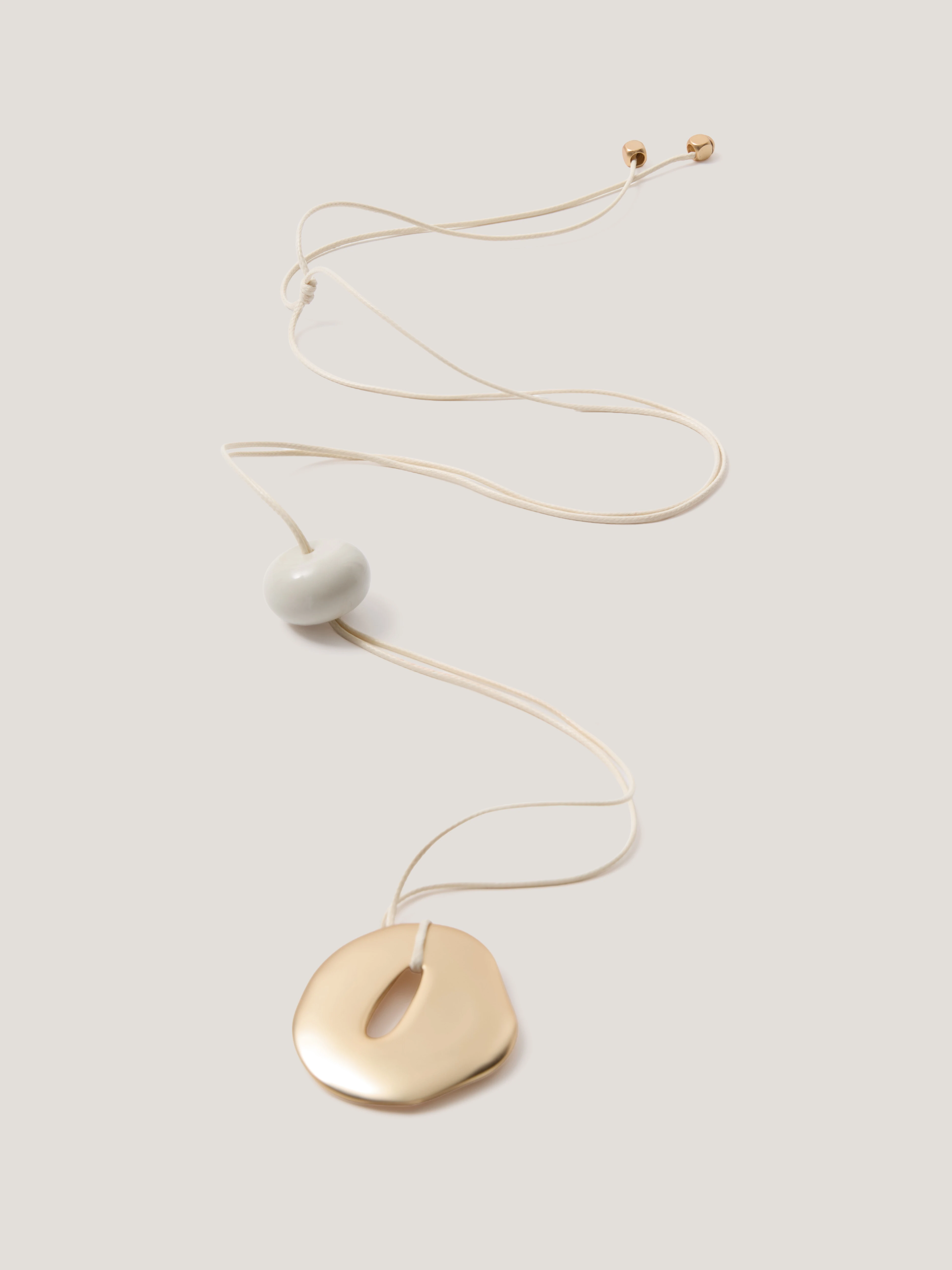 A minimalist gold-coloured necklace