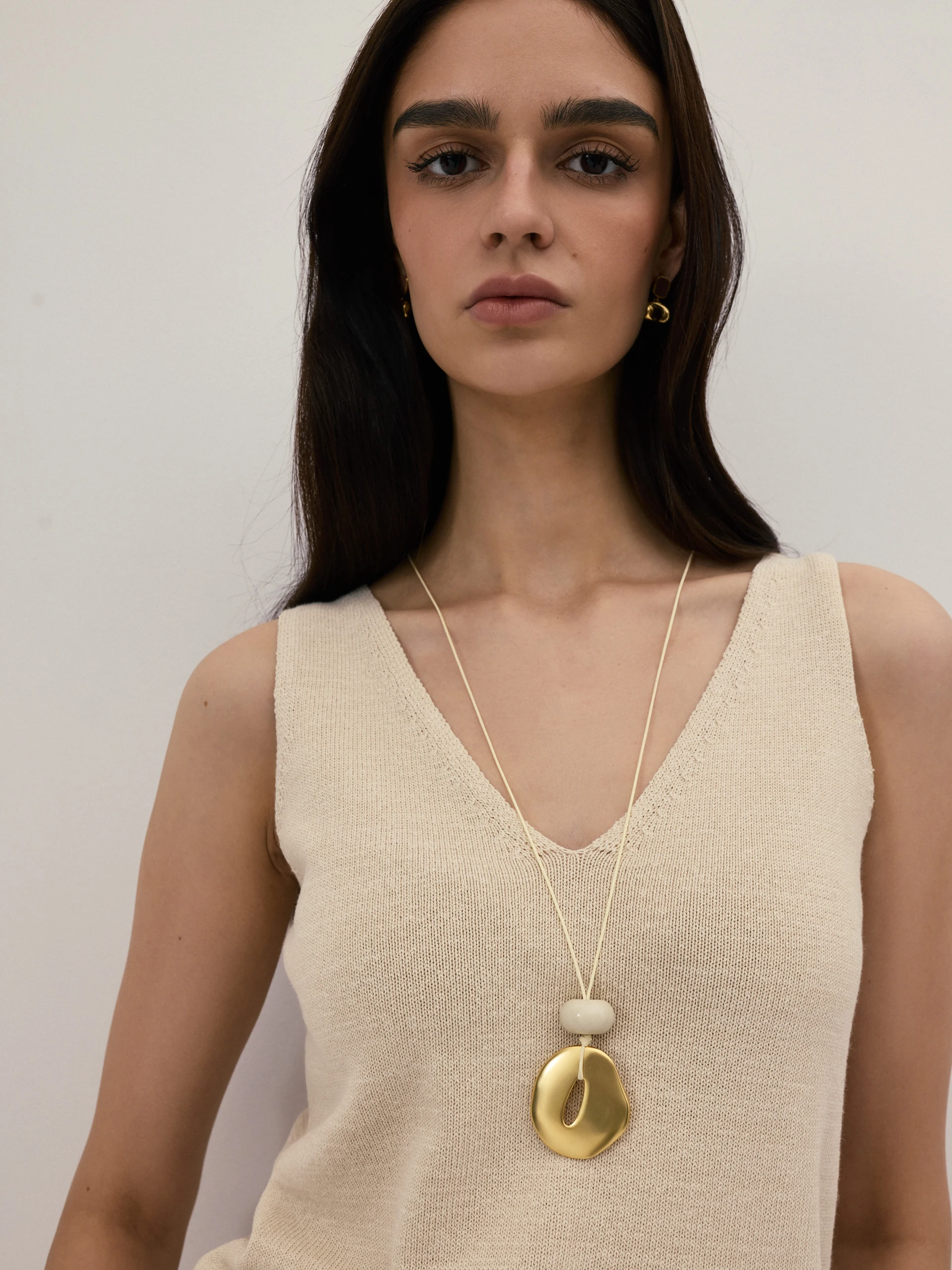 A minimalist gold-coloured necklace