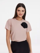 Undersized pink blouse with rose embellishment