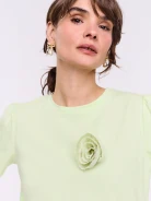 Lime short-sleeved blouse with a flower-shaped brooch