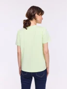Lime short-sleeved blouse with a flower-shaped brooch