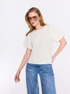 Cream-colored blouse with decorative sleeves