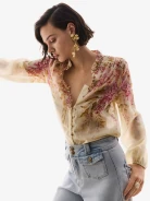 Creamy shirt with a stand-up collar and floral patterns