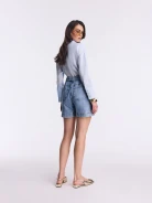 Light-colored high-waisted denim shorts