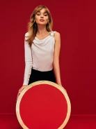 White asymmetrical blouse with matching cut