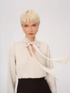 Cream blouse with a tie at the neck