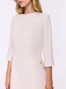 Creamy short dress with decorative buttons