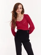 Openwork sweater in a shade of fuchsia