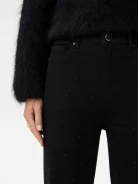Black bell-bottom pants with shiny detail