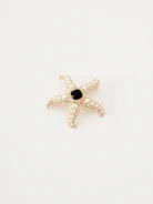 Starfish-shaped brooch with pearls