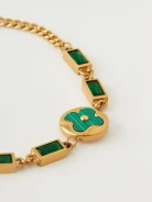 Gold color bracelet with green stones