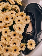 Black leather ballerinas decorated with buckles
