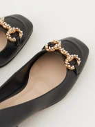 Black leather ballerinas decorated with buckles