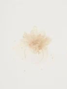 Fascinator in cream color with feathers