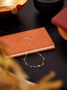 GOLD PLATED NECKLACE WITH PIGEON AND LEAVES