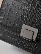 LEATHER BAG EMBOSSED IN CROCODILE PATTERN