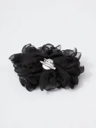 Large black flower-shaped brooch