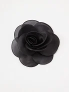 Black brooch with decorative flower