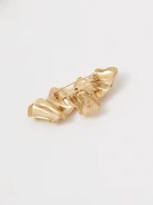 Gold-colored brooch with an irregular shape