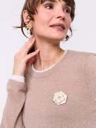 Flower-shaped brooch decorated with pearl beads