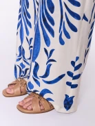 Caramel-colored leather flip-flops with a decorative buckle