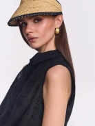A visor made of natural fibers with decorative trim