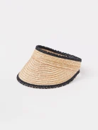 A visor made of natural fibers with decorative trim
