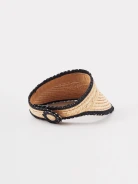A visor made of natural fibers with decorative trim