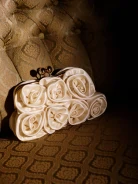 Cream-colored floral clutch