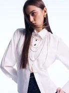Elegant white shirt with gold-colored buttons