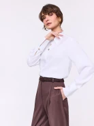 Elegant white shirt with gold-colored buttons