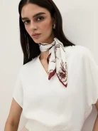 An elegant silk scarf with a floral pattern