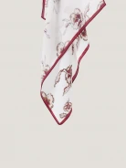 An elegant silk scarf with a floral pattern