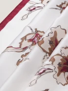 An elegant silk scarf with a floral pattern