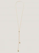 A long, gold-plated necklace with a bow