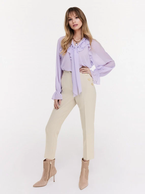 Beige cigarette pants with decorative buttons
