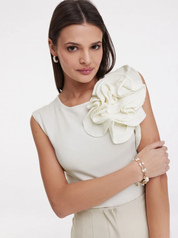 Cream blouse with three-dimensional flower