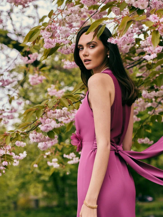 Asymmetrical pink dress with decorative flower