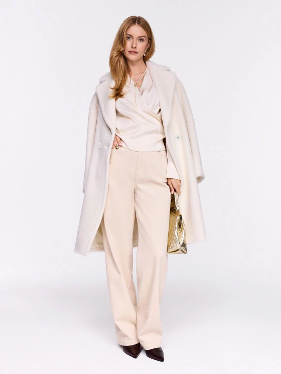 Cream high-waisted corduroy pants