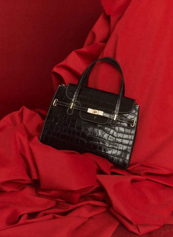 Chocolate leather bag with animal print
