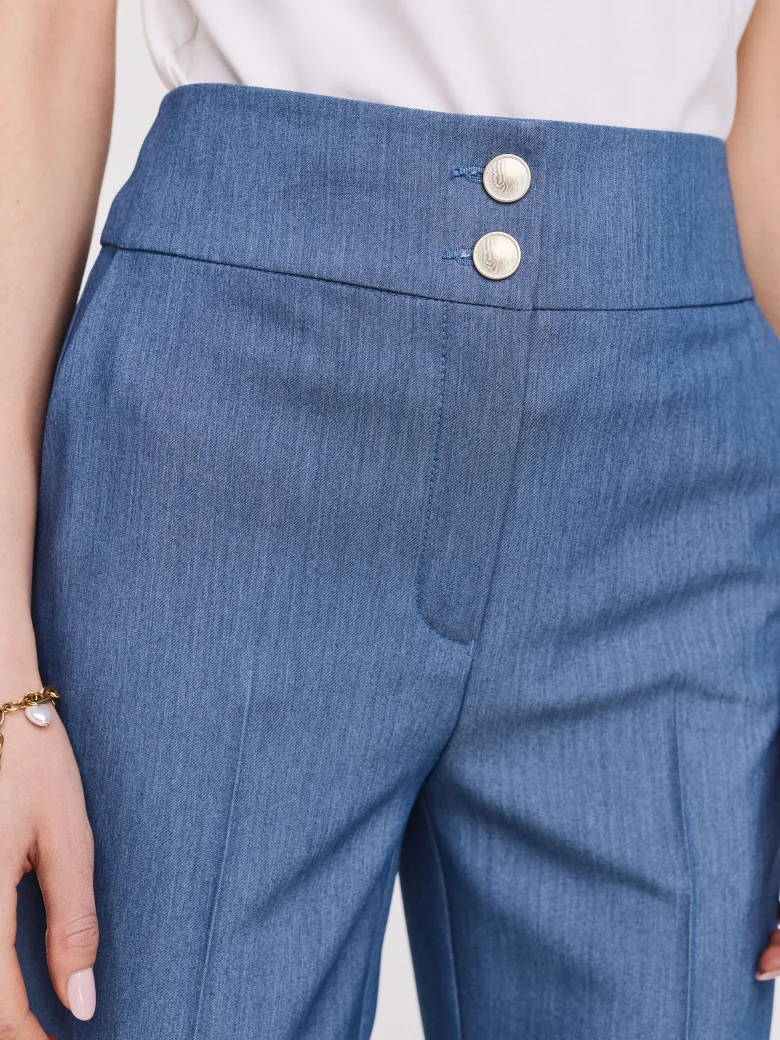 Blue pants with narrow legs and high rise