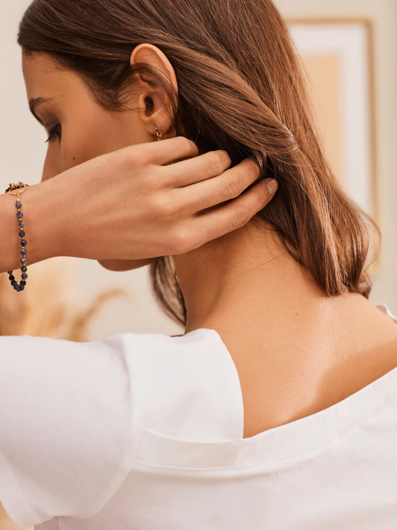 WHITE BLOUSE WITH ASYMMETRICAL NECKLINE