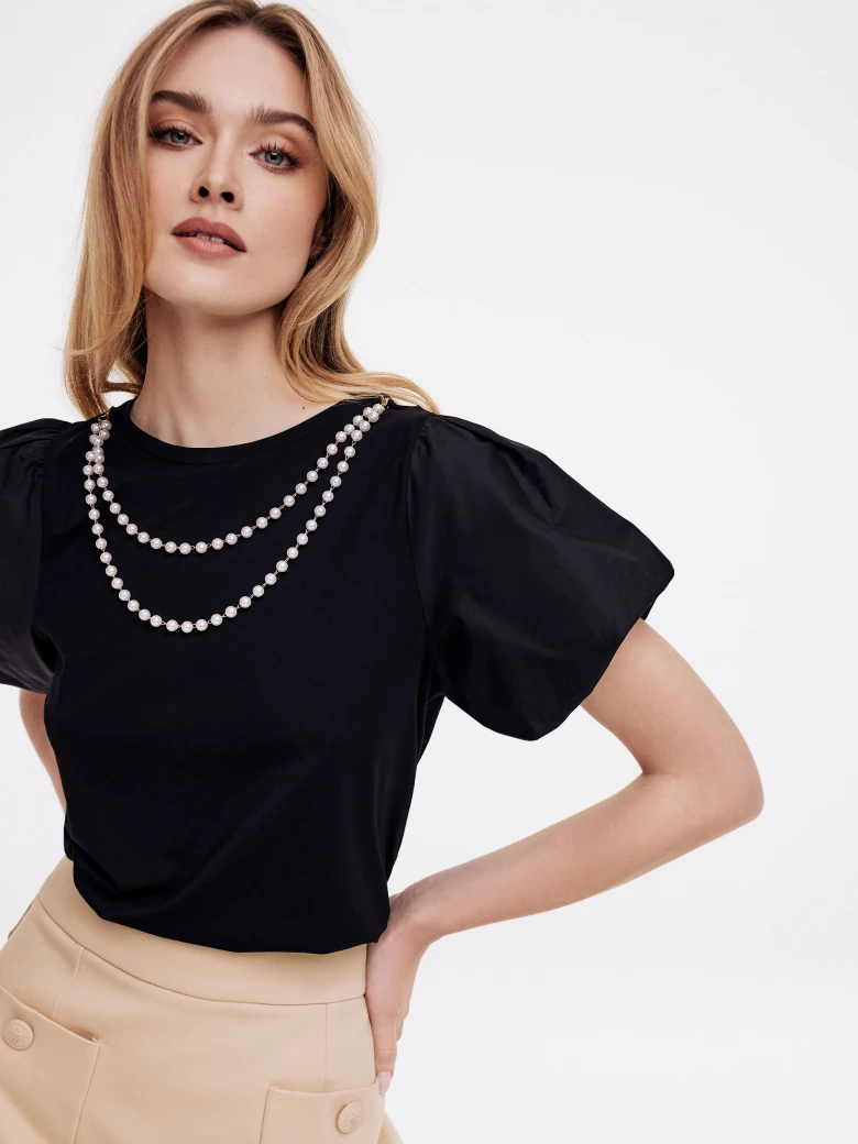 Black blouse with buff sleeves
