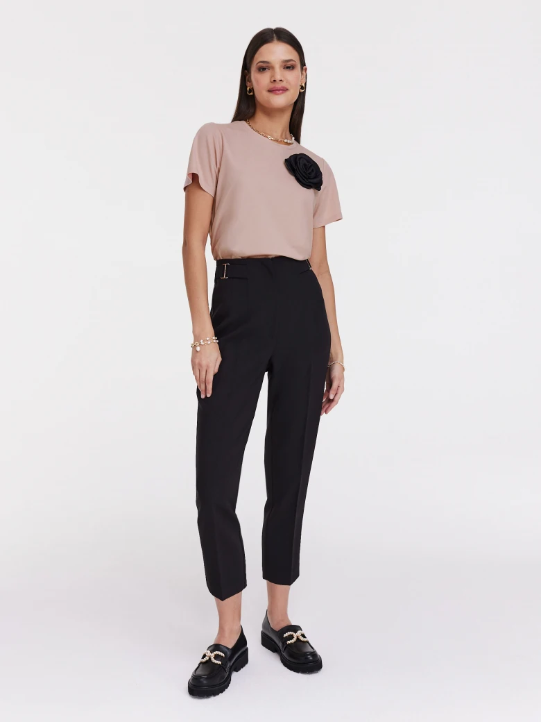 Undersized pink blouse with rose embellishment
