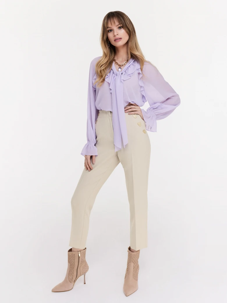Beige cigarette pants with decorative buttons