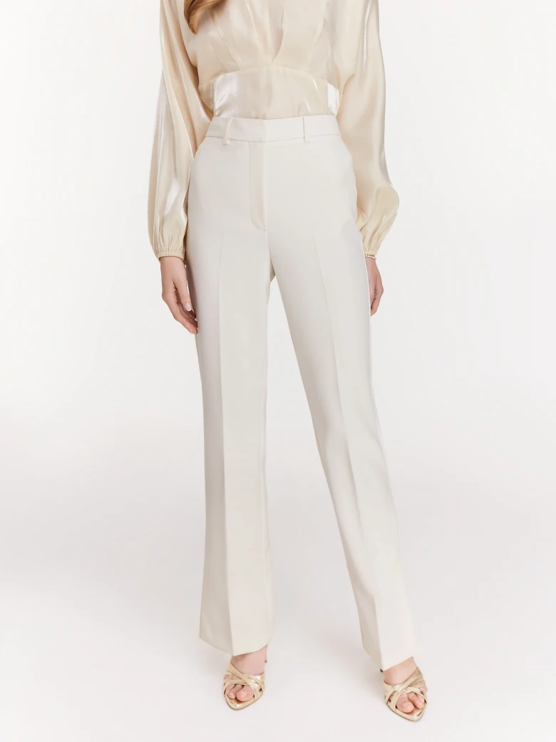 White pants with canted legs