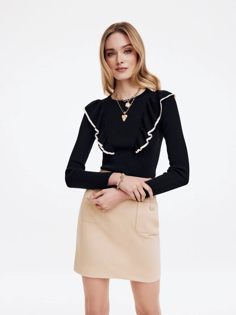 Black sweater with decorative ruffles