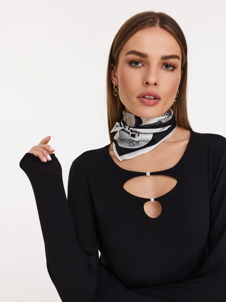Fitted black blouse with front cutouts